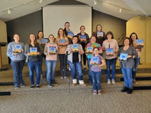 Women holding their art